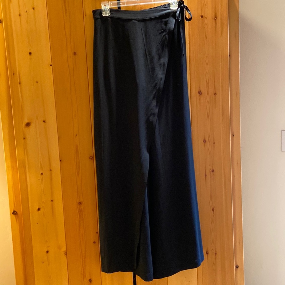 Eileen Fisher 100% Silk palazzo pants with a wrap panel that ties on the side.